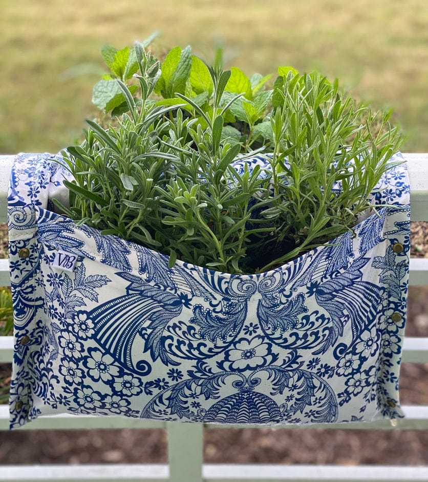 Blue paisley railing planter for flowers, plants and herbs like a saddle bag and hangs from the railing of a patio, balcony, deck or terrance.